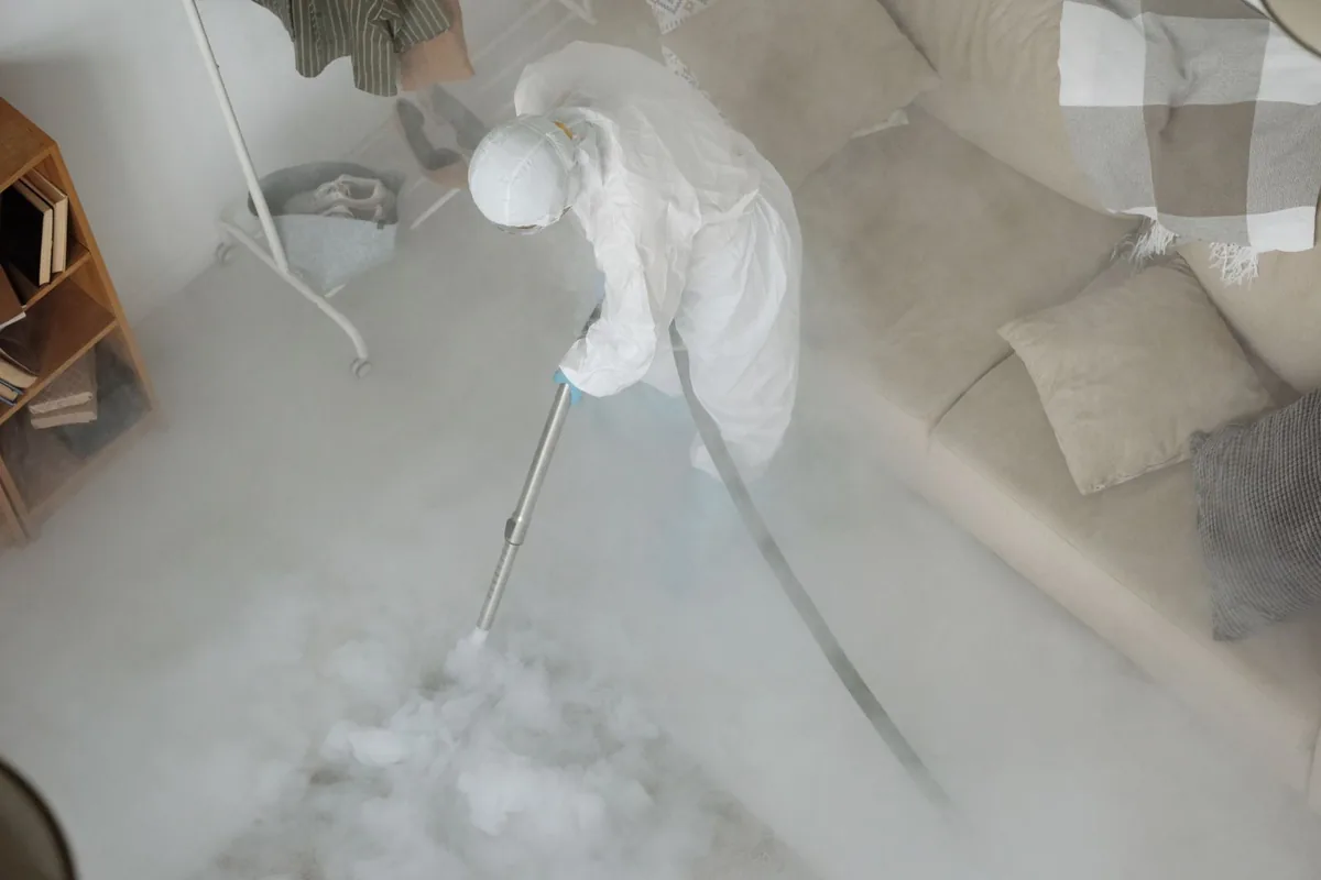Biohazard cleanup technician in protective equipment, Lumberton, MS